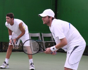 men playing doubles tennis