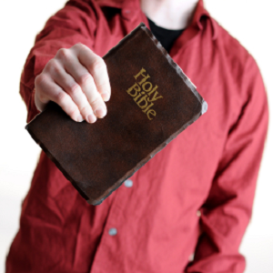 man holding bible