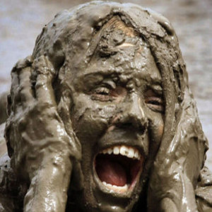 woman covered in mud