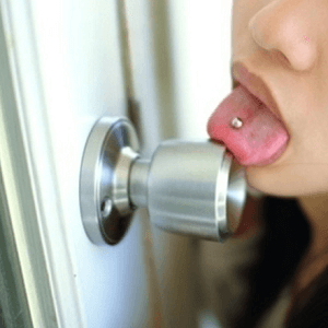 woman licking door knob