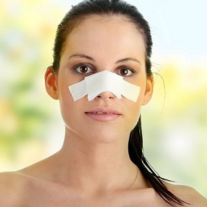 woman nose bandage