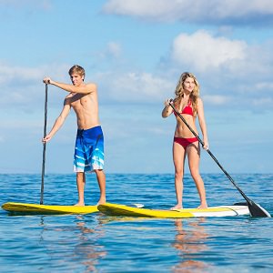 couple paddle board